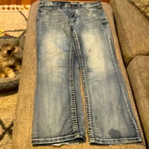 Worn men’s Ariat petrol relaxed bootcut blue jeans size 36X32